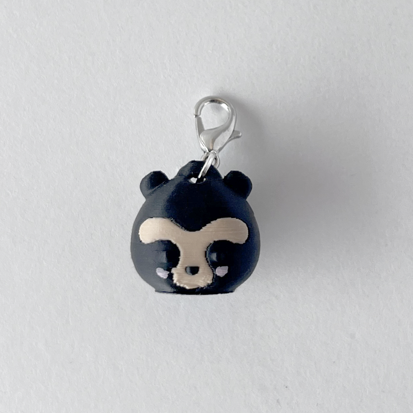 mini charm oso de anteojos