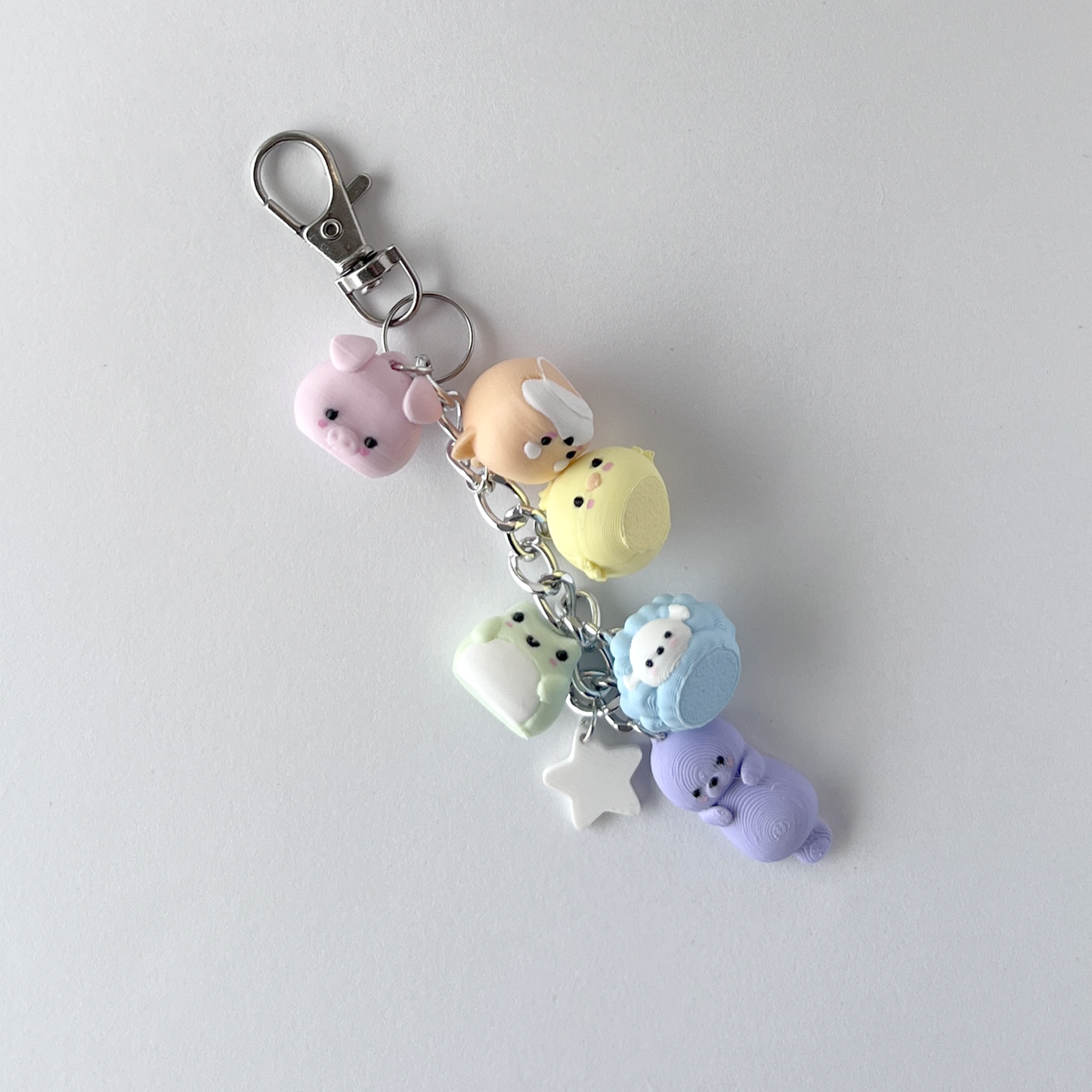 mini charm nubeja